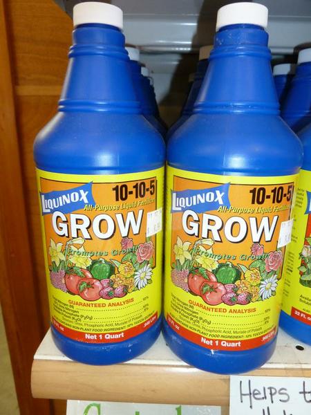 Blue bottles of liquid fertilizer